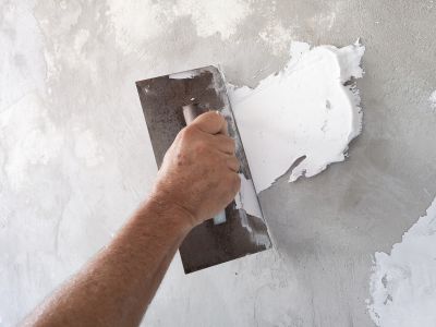 Handyman fixing drywall